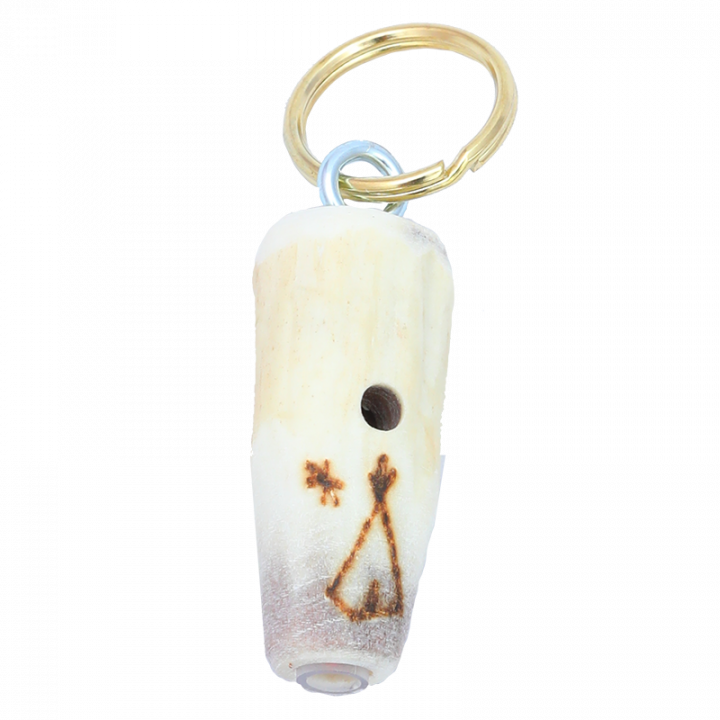 Key chain is handmade in Finland from reindeer antler. Key chain is decorated with traditional Lappish symbol and it has a whistle. Each key chain is unique, size and symbol may vary. Size approx. 7cm.