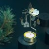 Rotary candle holder creates a cozy atmosphere and perfect as an interior detail. Just light the candle and watch the little metal christmas decoration figures rotate. Candle holder is gold-coloured and comes in a box. 1 tealight candle is included. Height approx.17cm. Great gift idea!