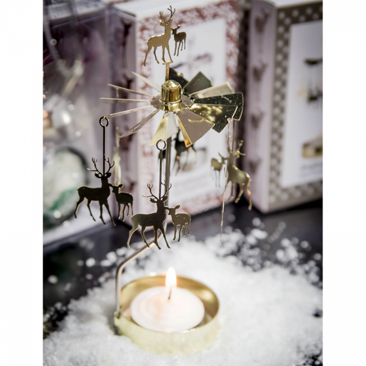 Rotary candle holder creates a cozy atmosphere and perfect as an interior detail. Just light the candle and watch the little reindeer metal figures rotate. Candle holder is gold-coloured and comes in a box, 1 tealight candle is included. Height approx.17cm.