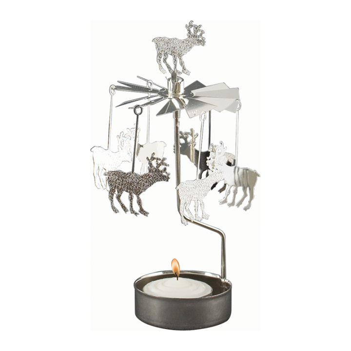 Rotary candle holder creates a cozy atmosphere and perfect as an interior detail. Just light the candle and watch the little metal reindeer figures rotate. Candle holder is silver-coloured and comes in a box. 1 tealight candle is included. Height approx.17cm.