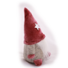 Elf boy with pink hat from side.