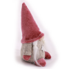 Elf girl with pink hat from side.